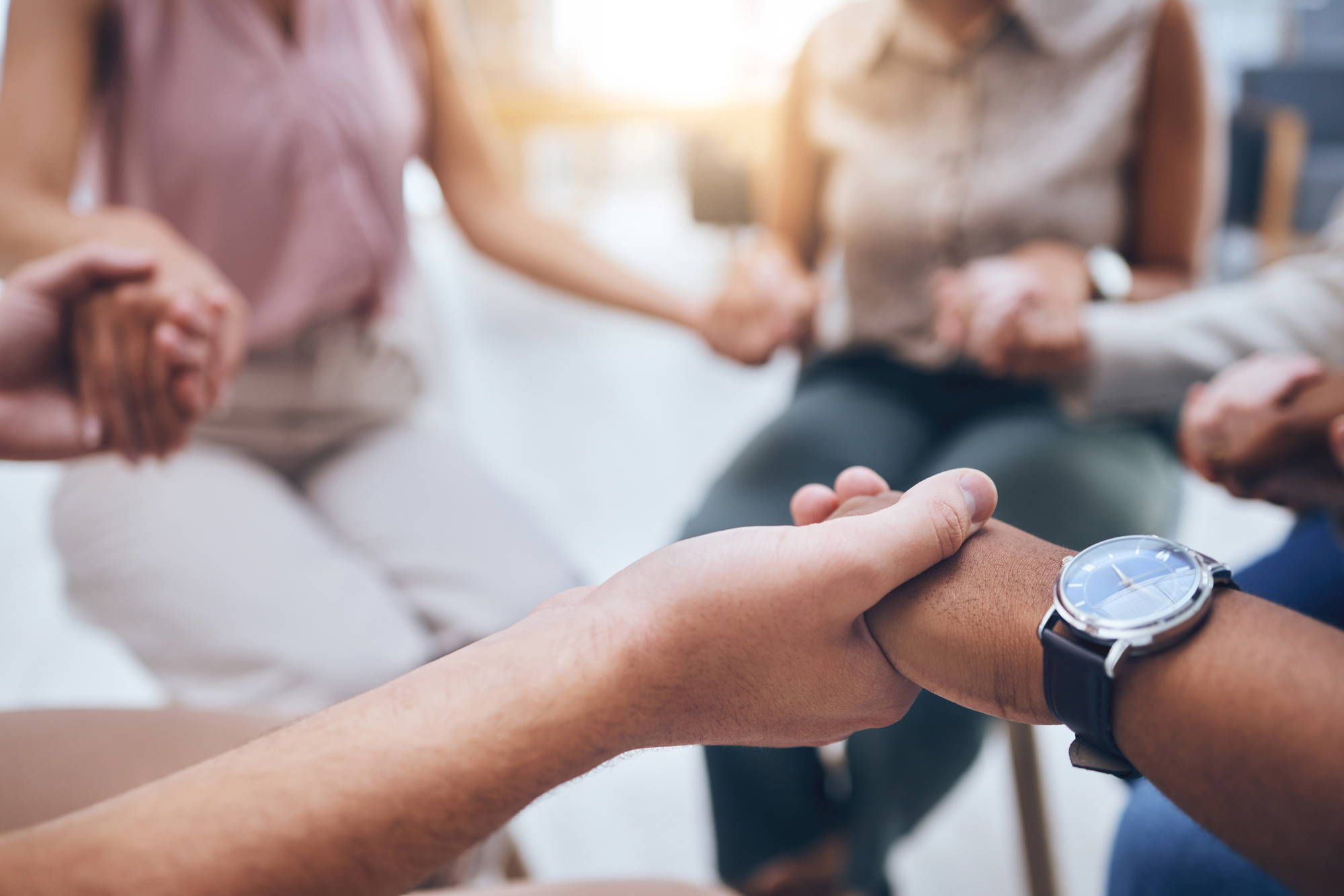 Hands, prayer and trust with people together in a support group for help, trust or worship in spiritual faith. Hope, friendship and community with friends in a circle of respect and religion